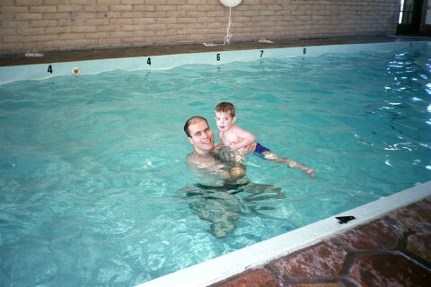 Eric and son Adam in a motel swimming pool